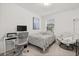 Serene bedroom offers a comfortable bed, desk area, and cozy chair for relaxation and productivity at 3256 Merton Aly, Orlando, FL 32808
