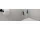 Modern toilet with toilet paper roll and brush at 3256 Merton Aly, Orlando, FL 32808