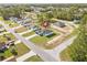 Aerial view of the property in its neighborhood showcasing the house, yard, and surrounding neighborhood at 3749 Sw 131St St, Ocala, FL 34473