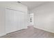 Bright bedroom features wood-look flooring, a closet, and neutral paint at 3749 Sw 131St St, Ocala, FL 34473