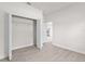 Bright bedroom features wood-look flooring, an open closet, and neutral paint at 3749 Sw 131St St, Ocala, FL 34473