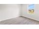 Cozy bedroom with new floors and a window overlooking a beautiful yard at 3749 Sw 131St St, Ocala, FL 34473