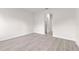 Spacious room with light wood flooring and white trim, offering a clean, modern aesthetic at 3749 Sw 131St St, Ocala, FL 34473
