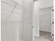 Walk-in closet featuring ample storage with metal shelving and a neutral color palette at 3749 Sw 131St St, Ocala, FL 34473