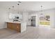 Modern kitchen featuring white cabinets, stainless steel appliances, and stylish island at 3749 Sw 131St St, Ocala, FL 34473