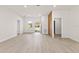 Open-concept living room with modern flooring, bright natural light, and neutral color palette at 3749 Sw 131St St, Ocala, FL 34473