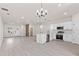 Spacious and modern living room connected to an open-concept kitchen and natural light at 3749 Sw 131St St, Ocala, FL 34473