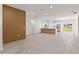 Open-concept living area with modern finishes, wood floors, and lots of natural light at 3749 Sw 131St St, Ocala, FL 34473