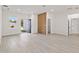 Bright and open living room with light wood flooring, modern decor, and plenty of natural light at 3749 Sw 131St St, Ocala, FL 34473