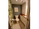 Cozy powder room with flamingo artwork and built in cabinet at 400 E Colonial Dr # 910, Orlando, FL 32803