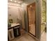 Bright bathroom features a glass-enclosed shower at 400 E Colonial Dr # 910, Orlando, FL 32803