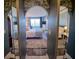 Bedroom view through an archway with patterned wallpaper at 400 E Colonial Dr # 910, Orlando, FL 32803