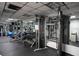 Bright gym featuring extensive weightlifting equipment and mirrored walls for fitness enthusiasts at 400 E Colonial Dr # 910, Orlando, FL 32803