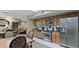 Well-appointed community kitchen with stainless steel appliances, cabinets, and countertop at 400 E Colonial Dr # 910, Orlando, FL 32803