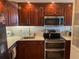 An updated kitchen features stainless steel appliances and modern backsplash at 400 E Colonial Dr # 910, Orlando, FL 32803