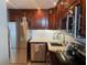 Updated kitchen boasts stainless steel appliances, stylish backsplash and recessed lighting at 400 E Colonial Dr # 910, Orlando, FL 32803