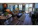 Sun-filled living room featuring hardwood floors, large windows with a view, and comfortable seating at 400 E Colonial Dr # 910, Orlando, FL 32803