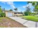 A single-story home featuring a well-manicured lawn, a garage, and an extended driveway at 4015 Ibis Dr, Orlando, FL 32803