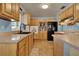 Charming kitchen with wooden cabinets, light countertops, and modern appliances at 4015 Ibis Dr, Orlando, FL 32803