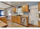 Well-equipped kitchen with wooden cabinetry, updated appliances, and a convenient layout at 4015 Ibis Dr, Orlando, FL 32803