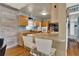 Updated kitchen featuring wooden cabinets, breakfast bar, and modern appliances at 4015 Ibis Dr, Orlando, FL 32803