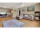 Cozy living area with a comfortable sofa, decorative rug, and eat-in counter with bar stools at 4015 Ibis Dr, Orlando, FL 32803
