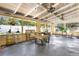 Sunroom with bright lighting, ceiling fans, potted plants, outdoor furniture, and large windows at 4015 Ibis Dr, Orlando, FL 32803
