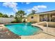 Backyard pool featuring landscaping, patio, and partial view of the house under a bright blue sky at 4015 Ibis Dr, Orlando, FL 32803