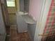Dated bathroom with a pedestal sink and a wood countertop at 4231 Raleigh St, Orlando, FL 32811