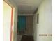 Hallway with water damage and dirty walls needing repairs in a fixer upper house at 4231 Raleigh St, Orlando, FL 32811