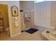 Light and bright bathroom featuring a shower with nautical themed curtain and tiled walls at 4351 Winding Oaks Cir, Mulberry, FL 33860