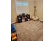 Bedroom featuring carpet flooring, window with shutters, beanbag chair, and storage at 4351 Winding Oaks Cir, Mulberry, FL 33860
