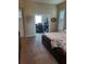 This bedroom features neutral carpet and plantation shutters, along with an attached office space at 4351 Winding Oaks Cir, Mulberry, FL 33860