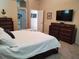 A well-lit bedroom showcases an entertainment center and coordinating nautical decor at 4351 Winding Oaks Cir, Mulberry, FL 33860
