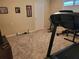 Carpeted workout room featuring a treadmill, exercise bike, and motivational decor at 4351 Winding Oaks Cir, Mulberry, FL 33860