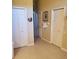 Hallway with tiled flooring and a series of closets at 4351 Winding Oaks Cir, Mulberry, FL 33860