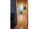 Tiled hallway with nautical themed decor and a view into the patterned shower curtain at 4351 Winding Oaks Cir, Mulberry, FL 33860