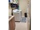 Functional laundry room equipped with a washer, dryer, and utility sink at 4351 Winding Oaks Cir, Mulberry, FL 33860