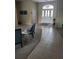 Inviting living room with tile floors and a decorative front door that welcomes you into a cozy sitting area at 4351 Winding Oaks Cir, Mulberry, FL 33860