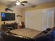 The living room features a TV and modern media center, with a ceiling fan and sleek, minimalist blinds at 4351 Winding Oaks Cir, Mulberry, FL 33860