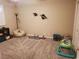 Spacious carpeted playroom with ample space for playing and a coastal themed decor at 4351 Winding Oaks Cir, Mulberry, FL 33860