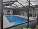 Sparkling screened-in pool with ample deck space, offering a private oasis for relaxation and fun at 4351 Winding Oaks Cir, Mulberry, FL 33860