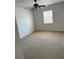 A bedroom with neutral carpeting and a ceiling fan at 436 Hammerstone Ave, Haines City, FL 33844