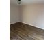 Bedroom with wood-look flooring and flush mount light fixture at 436 Hammerstone Ave, Haines City, FL 33844