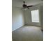 Neutral toned bedroom featuring a ceiling fan and a bright window with blinds at 436 Hammerstone Ave, Haines City, FL 33844