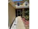 Inviting front porch with colorful garden bed at 436 Hammerstone Ave, Haines City, FL 33844