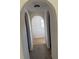 Hallway with carpet flooring, arched doorways leading to other rooms at 436 Hammerstone Ave, Haines City, FL 33844