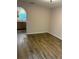Bright living room features hardwood floors and an arched entry to the kitchen area at 436 Hammerstone Ave, Haines City, FL 33844