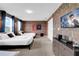 Comfortable bedroom featuring two beds, themed artwork and brick accent wall at 4530 Narrative Ln, Kissimmee, FL 34746