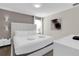 Cozy bedroom featuring a plush bed and decorative wall art at 4530 Narrative Ln, Kissimmee, FL 34746